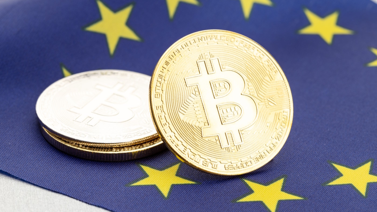 Bitcoin cryptocurrency coins on national flag of European Union. Crypto law regulation concept