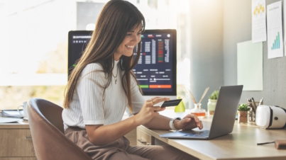 Credit card, laptop or happy woman typing on stock market or cryptocurrency website for financial p.