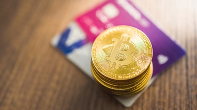 Cryptocurrency. Bitcoin virtual money. Golden coins and the credit cards